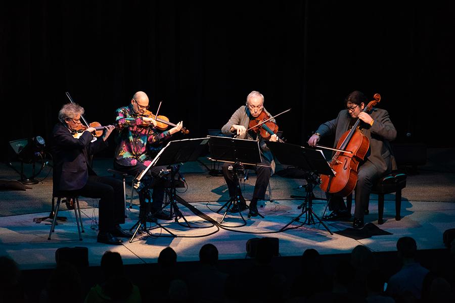 Kronos Quartet performing live on stage for their "Five Decades" tour
