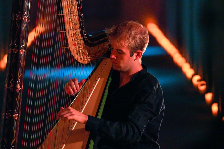 Harpist Parker Ramsay in action playing the harp