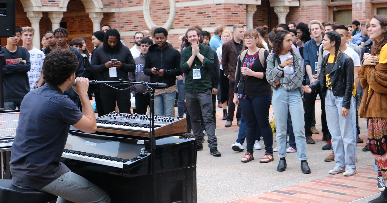 Students on the terrace enjoying a DJ and music