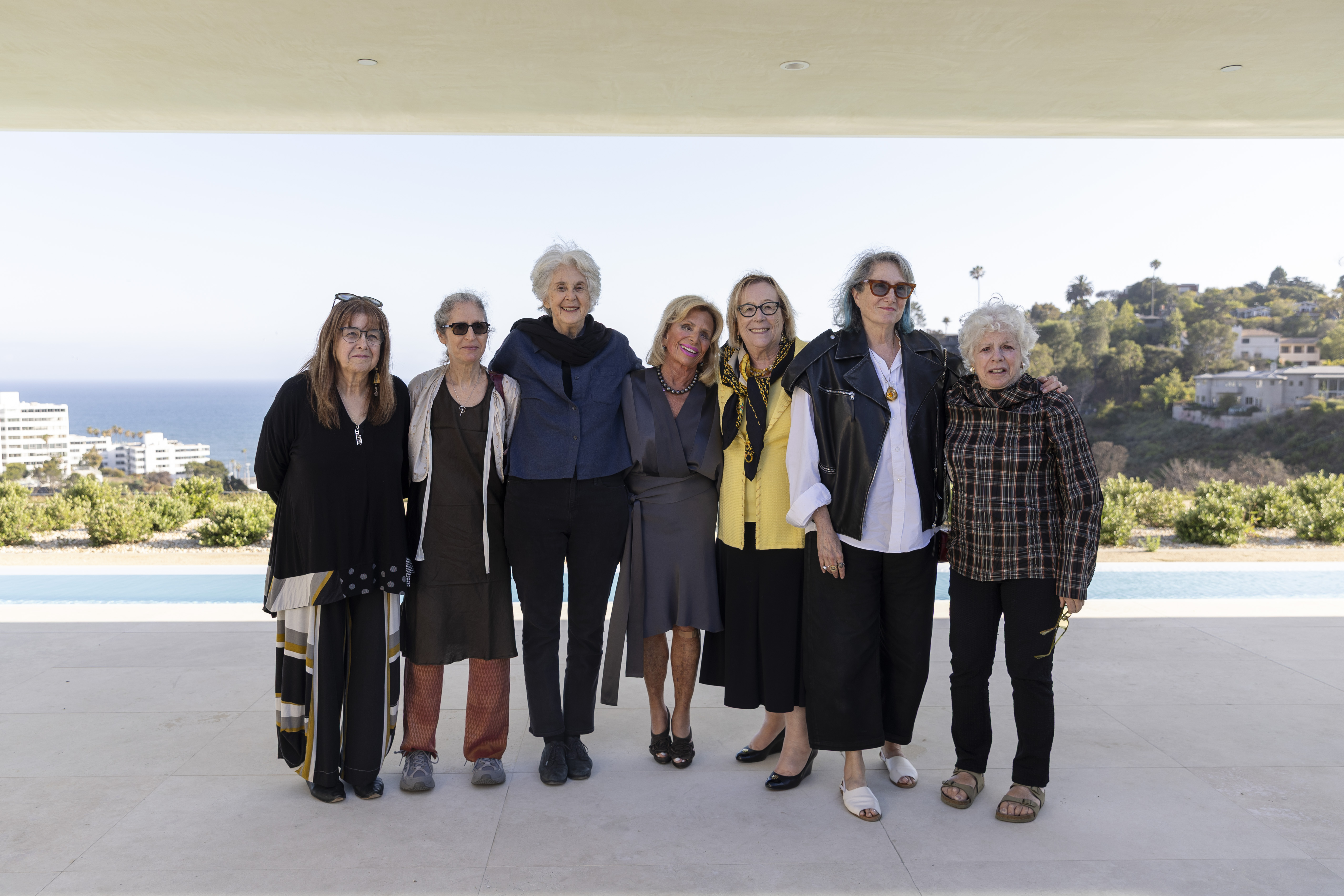 Found members of Far Away, Here posed together at an event