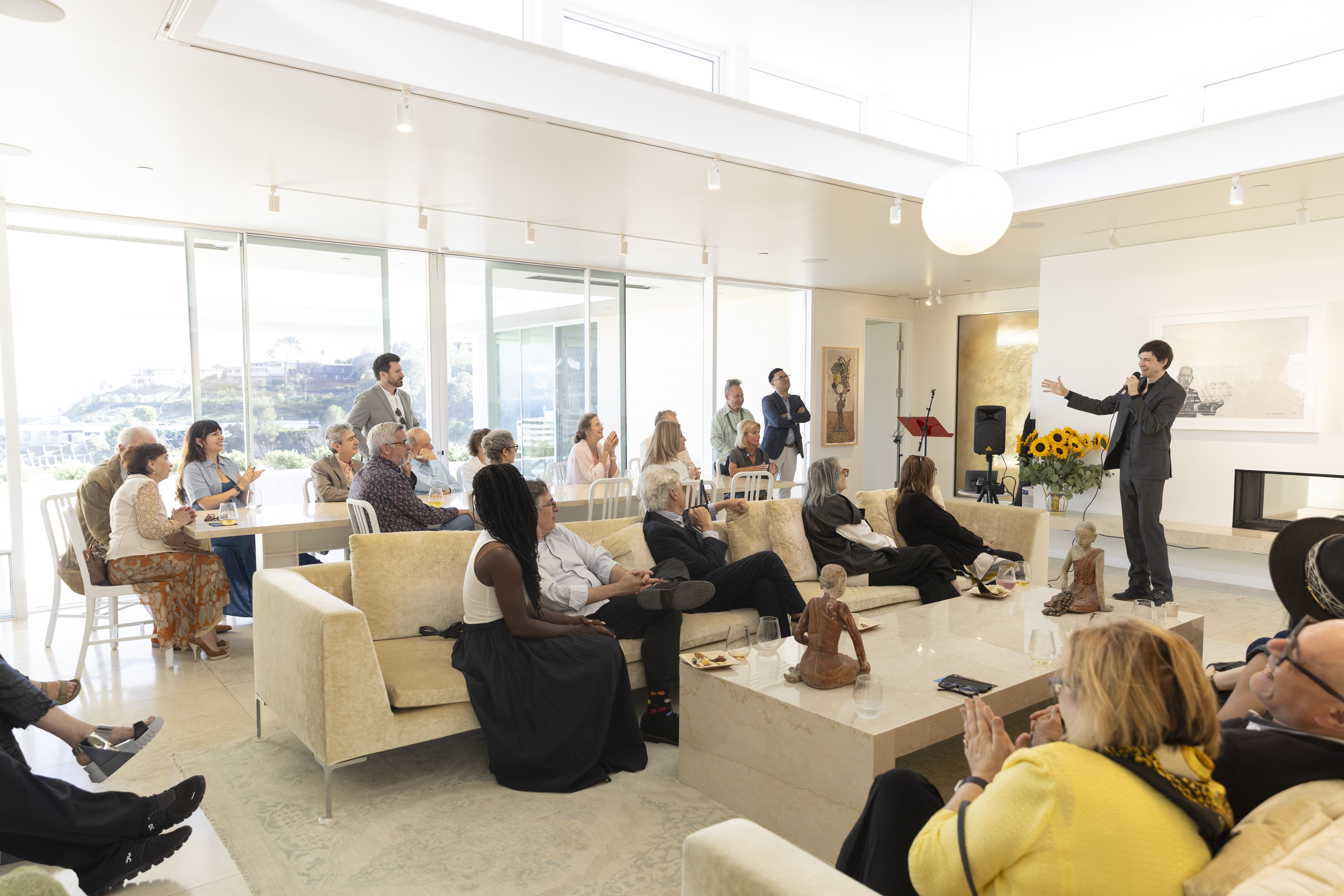 A group of people sitting in a livingroom