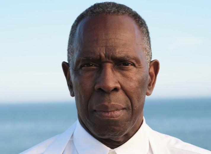 Headshot of Charles Gaines set against the ocean