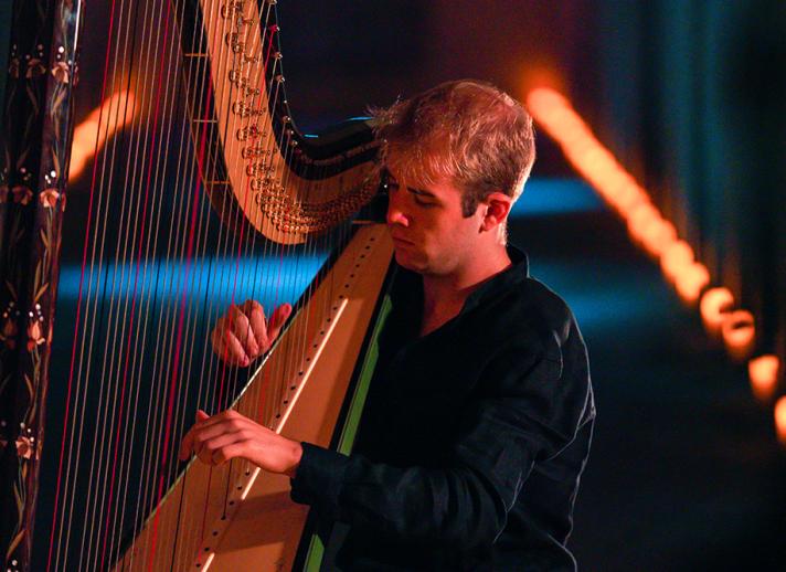 Harpist Parker Ramsay in action playing the harp