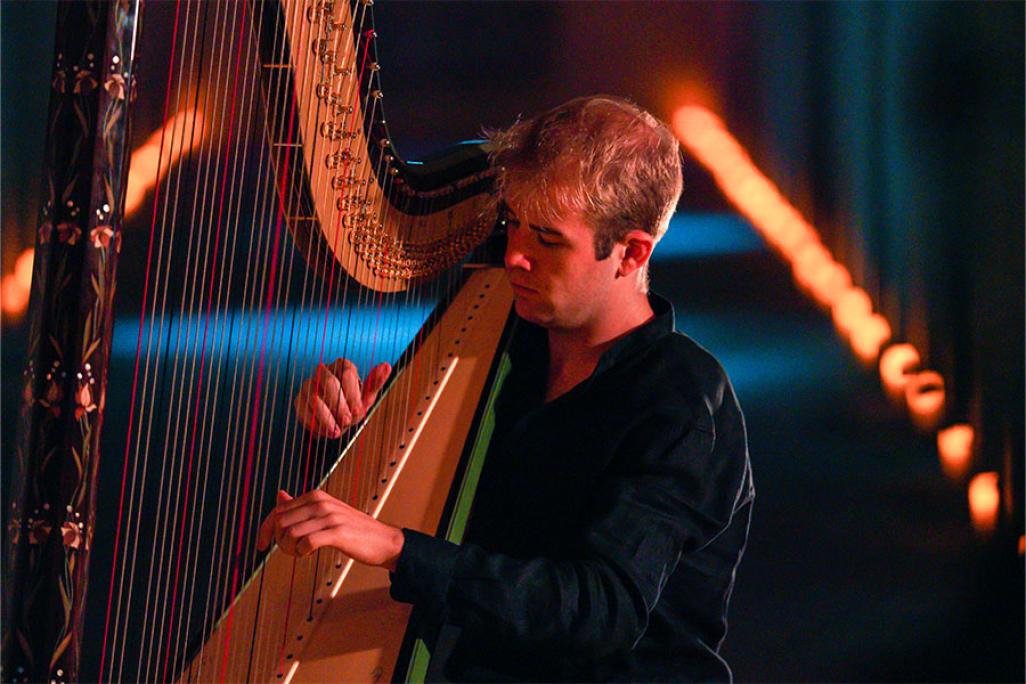 Person playing the harp