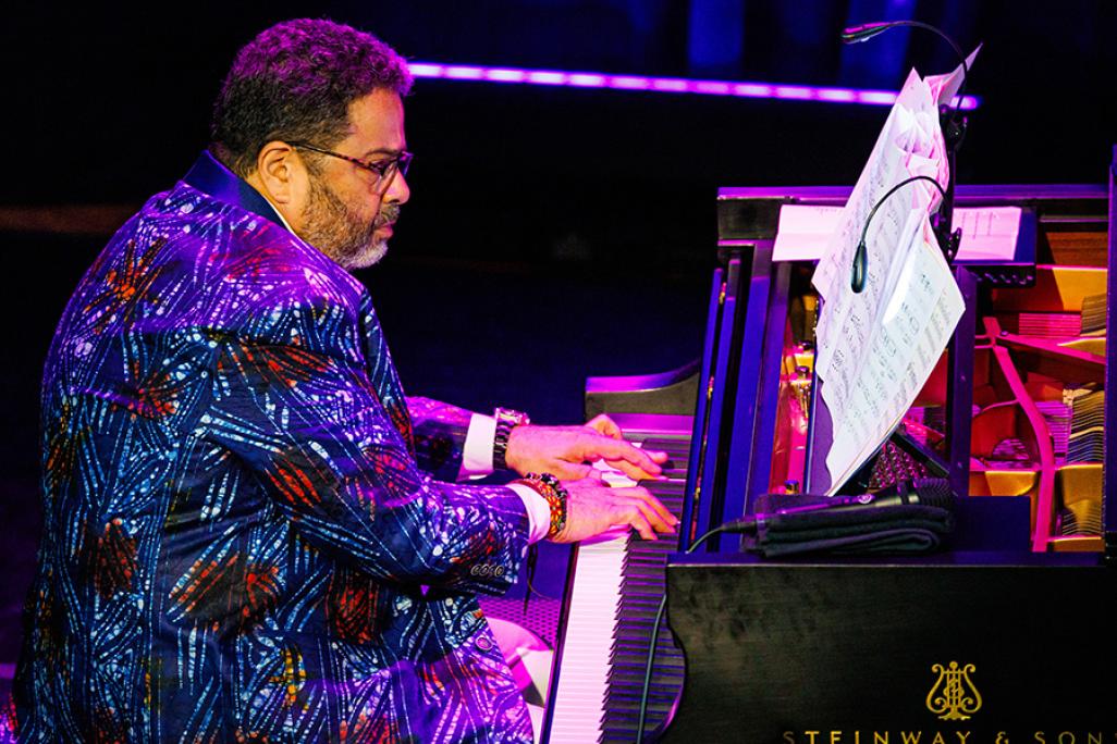 Arturo O'Farill plays piano on stage