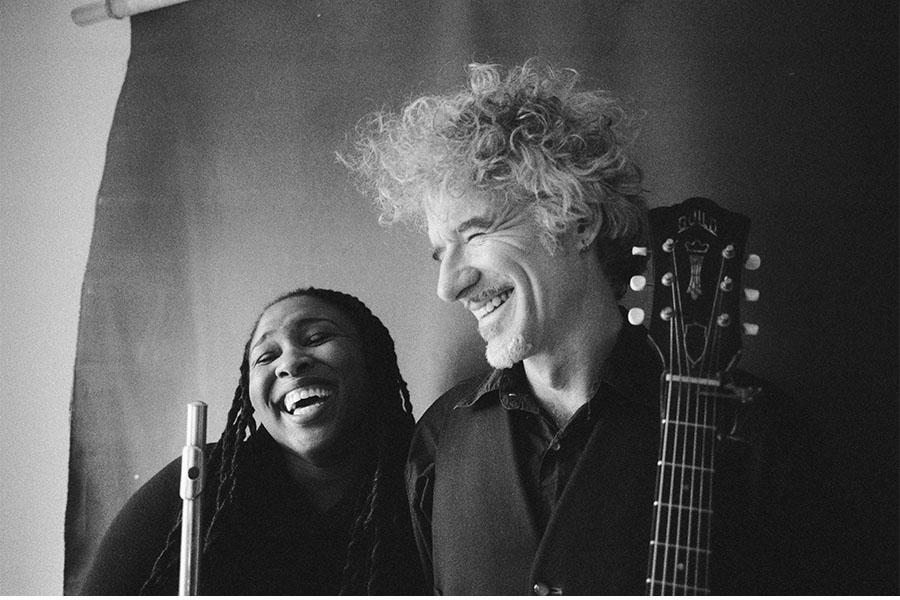 Black and white image of Dan and Claudia Zanes laughing