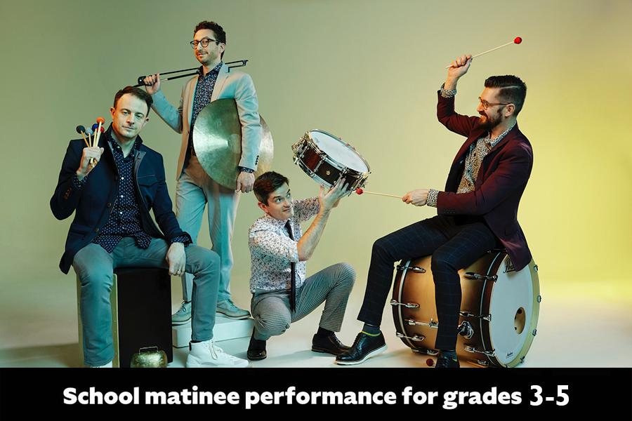 Members of Third Coast Percussion playfully interacting with each other with instruments amongst taking group photo