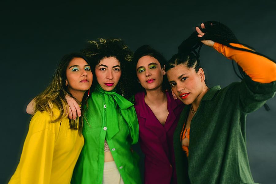 LADAMA posing for a candid colorful group shot