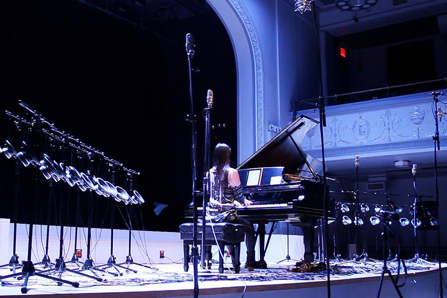Vicky Chow plays the piano on stage