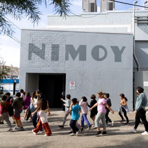 Kids walking outside of The Nimoy