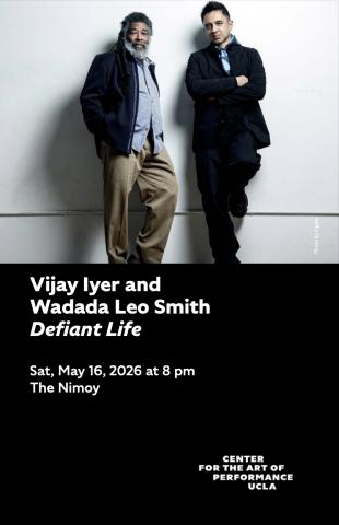 Program cover for Vijay Iyer and Wadada Leo Smith's performance, featuring image of Smith and Iyer leaning against a gray wall, staring direct to camera. 