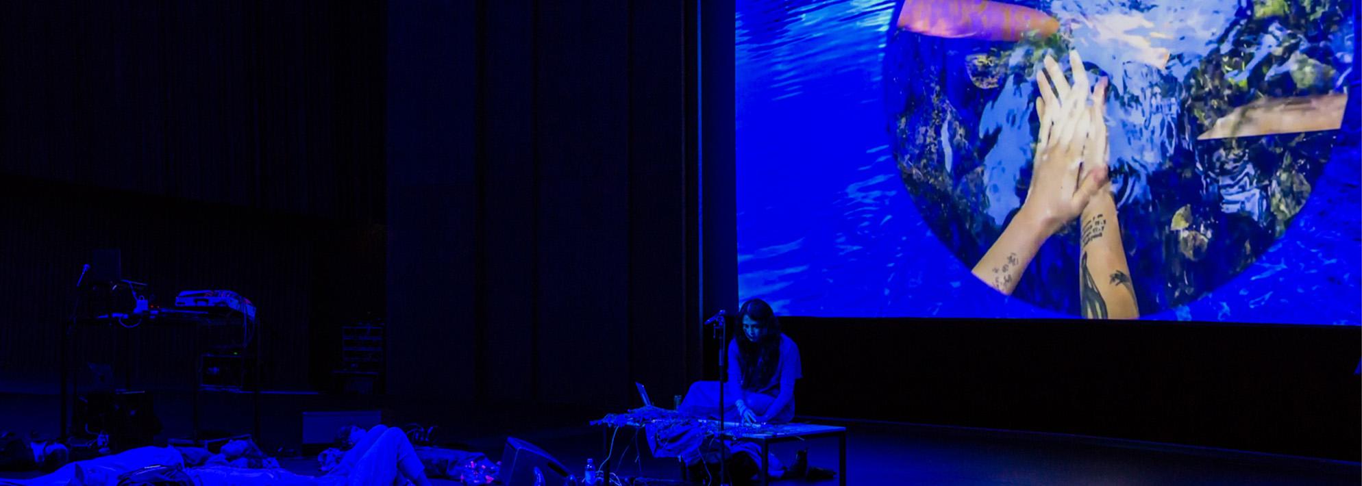 Artist Paige Emery on stage 