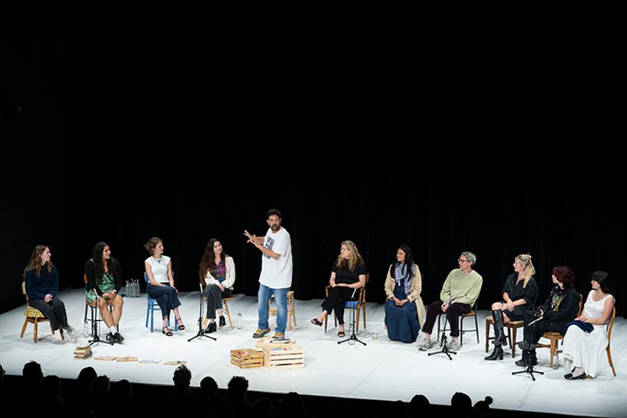 Tiago Rodrigues on stage with audience members for "By Heart"